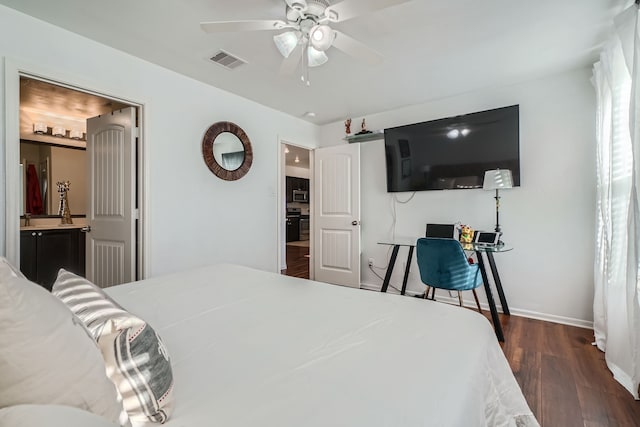 bedroom featuring ensuite bathroom, ceiling fan, and dark hardwood / wood-style flooring