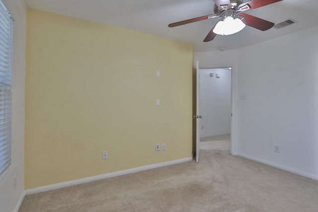 carpeted empty room with ceiling fan