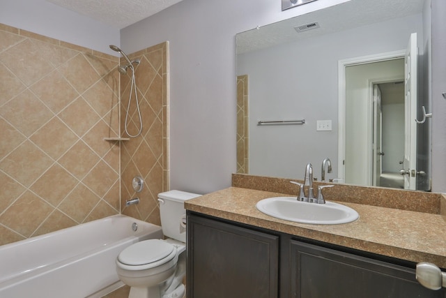 full bath featuring vanity, visible vents, a textured ceiling, bathing tub / shower combination, and toilet