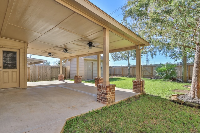 view of yard featuring ceiling fan and a patio area