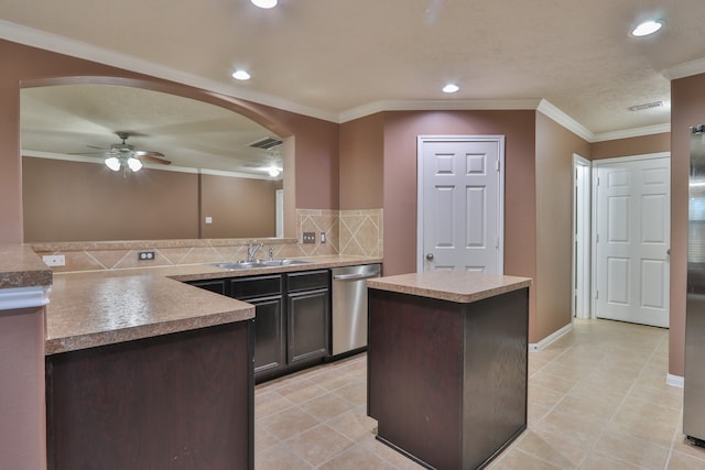 kitchen with dishwasher, dark brown cabinetry, sink, ceiling fan, and a kitchen island