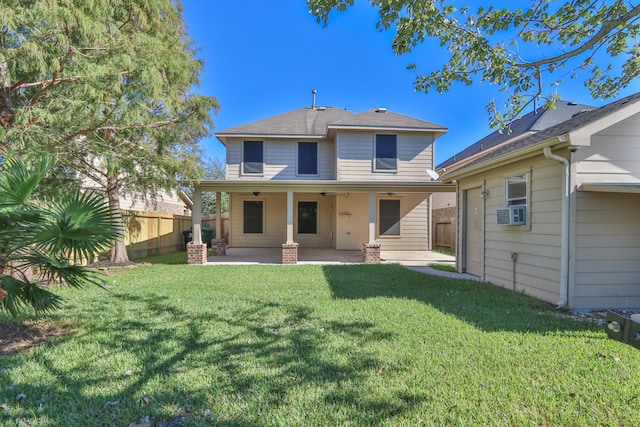 back of house featuring a ceiling fan, a patio, fence, a yard, and cooling unit