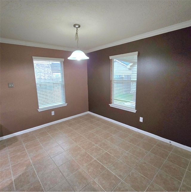 unfurnished room with plenty of natural light, baseboards, and ornamental molding