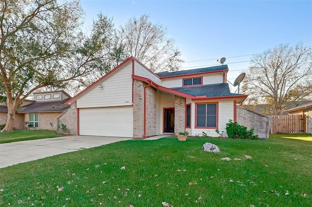 view of front of home featuring a garage and a front lawn