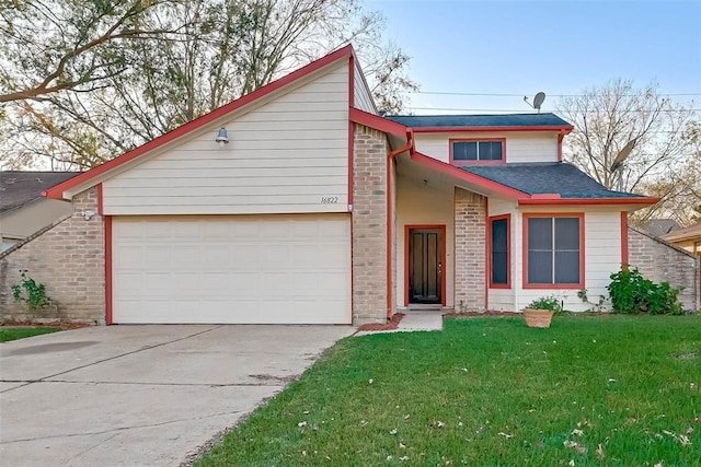 view of front of property featuring a front lawn and a garage