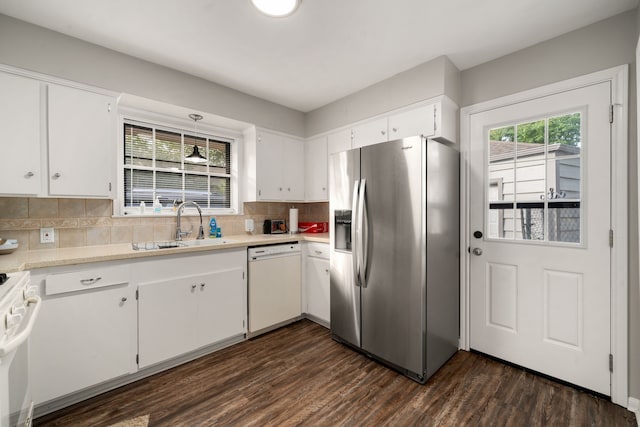 kitchen with white cabinets, white appliances, and dark wood-type flooring