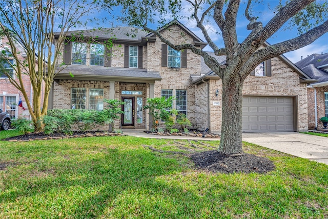 view of front of house featuring a front lawn and a garage