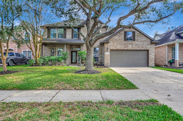 view of front facade featuring a garage and a front yard