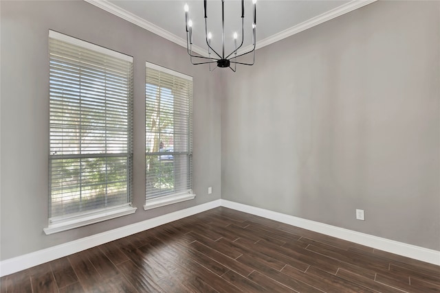 unfurnished room with ornamental molding, a healthy amount of sunlight, and dark hardwood / wood-style floors