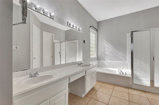 bathroom featuring tile patterned flooring, vanity, and plus walk in shower