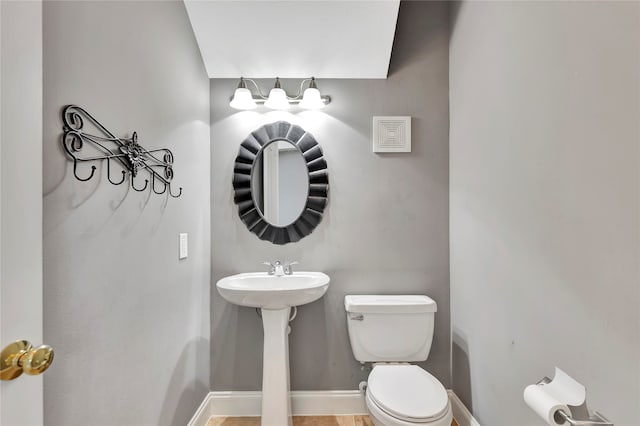 bathroom featuring tile patterned flooring and toilet