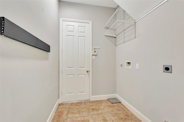 clothes washing area featuring hookup for an electric dryer, gas dryer hookup, hookup for a washing machine, and light tile patterned flooring