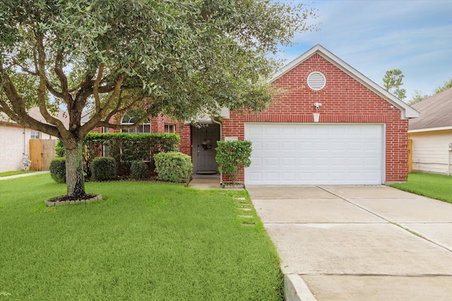 view of front of home featuring a front yard and a garage