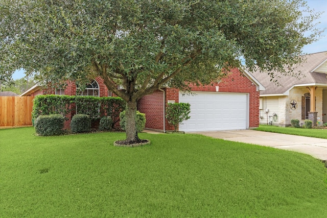 view of front of home with a garage and a front yard