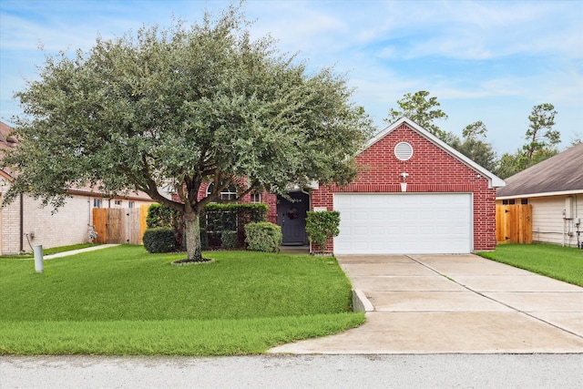 view of front of property with a garage and a front yard