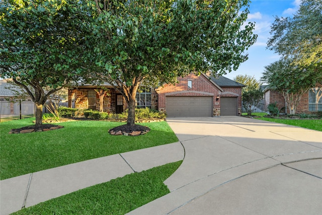 view of front of property with a front yard and a garage