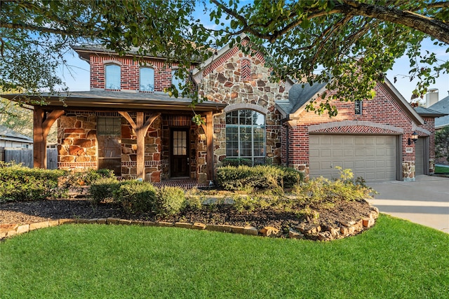 view of front of property featuring a front lawn, covered porch, and a garage