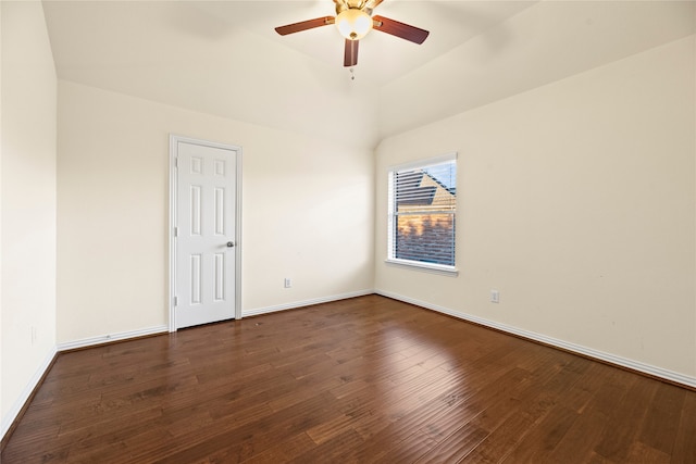 empty room with ceiling fan and dark hardwood / wood-style flooring