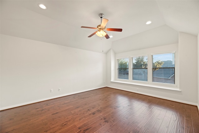 spare room featuring ceiling fan, wood-type flooring, and vaulted ceiling