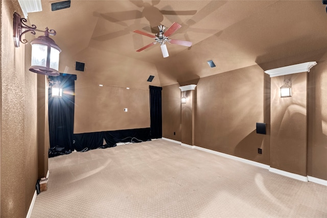 carpeted cinema featuring ceiling fan and lofted ceiling