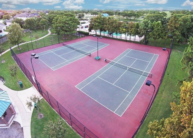 view of sport court featuring basketball hoop