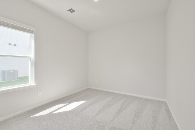 empty room with light colored carpet