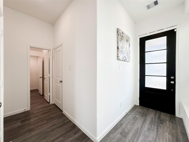 entryway with dark wood-type flooring