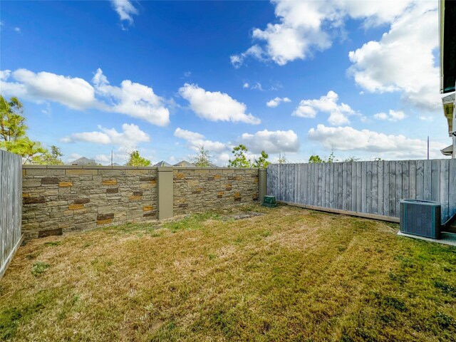 view of yard with central AC