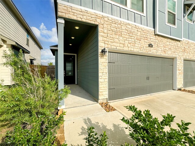 view of exterior entry featuring a garage