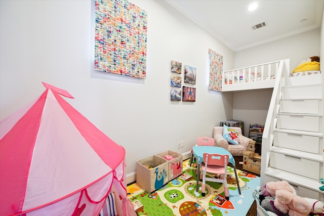 bedroom with wood-type flooring and crown molding