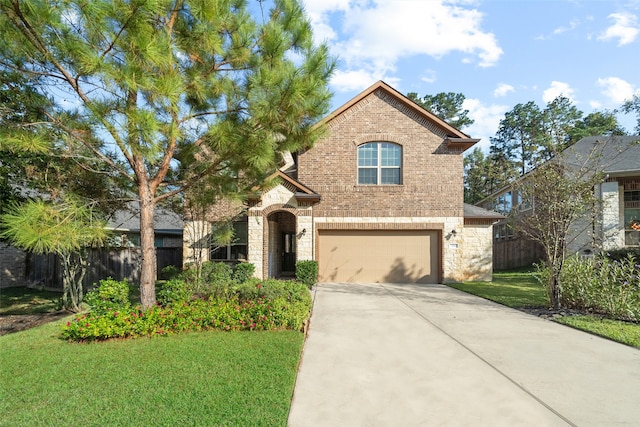 view of front of home featuring a garage and a front yard