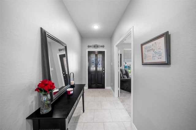 entrance foyer featuring light tile patterned floors