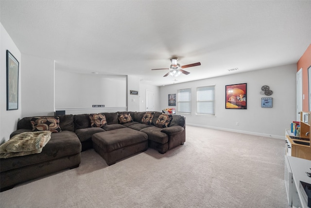 carpeted living room featuring ceiling fan