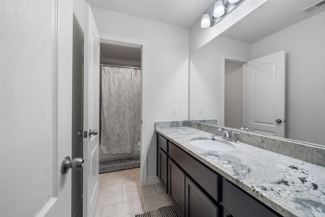 bathroom featuring vanity, tile patterned flooring, and a shower with curtain