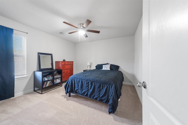 carpeted bedroom with ceiling fan