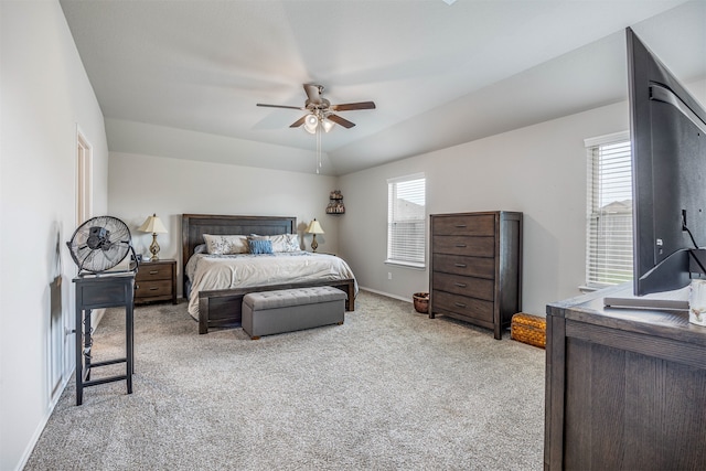 carpeted bedroom with multiple windows and ceiling fan