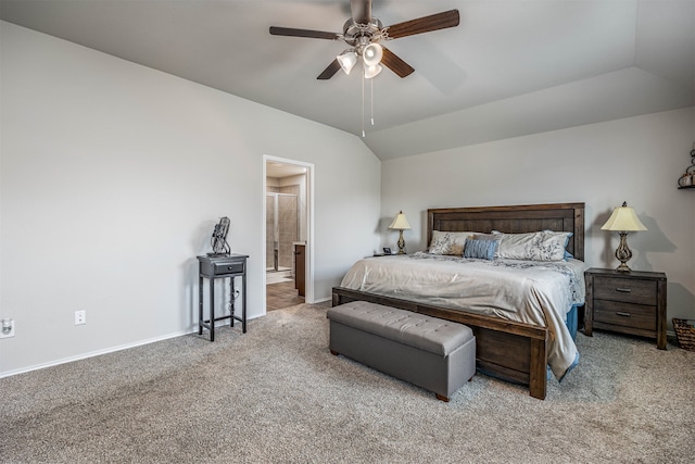 bedroom featuring ensuite bathroom, ceiling fan, lofted ceiling, and light colored carpet