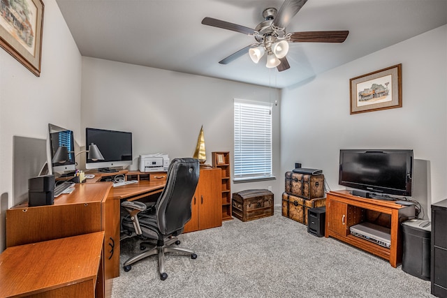 home office featuring ceiling fan and light carpet