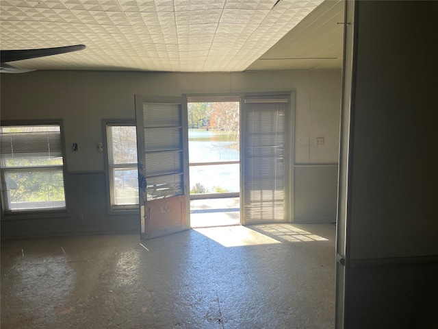 doorway featuring a wealth of natural light and a water view