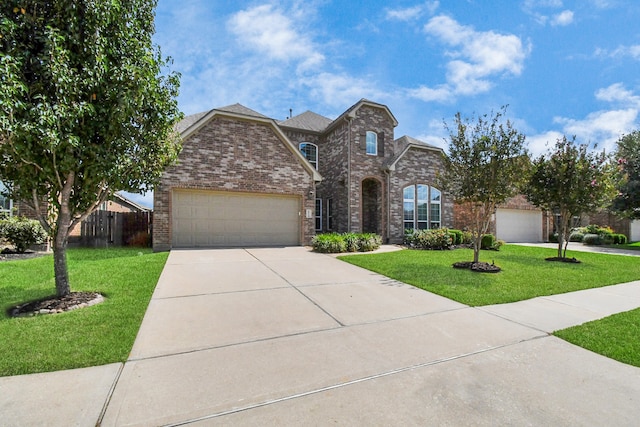 view of front of house featuring a garage and a front yard