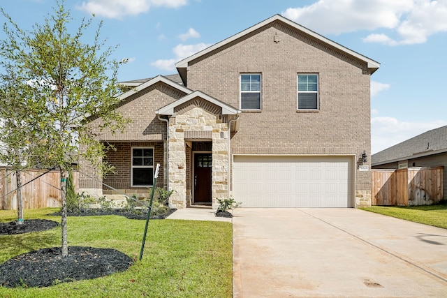 view of front of home featuring a front yard and a garage