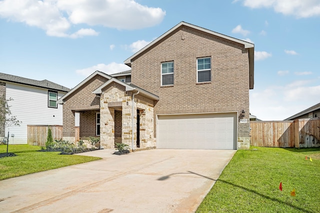 view of front of property featuring a front yard and a garage