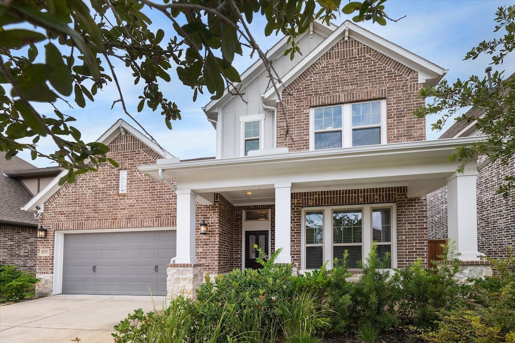 view of front of house with a garage and a porch