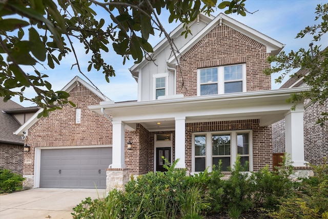 view of front of house with a garage and a porch