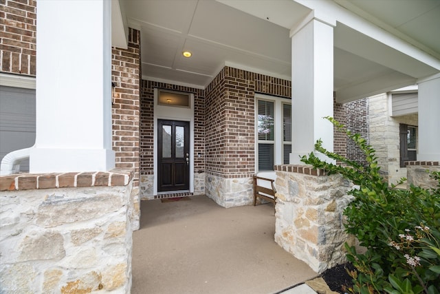 property entrance with covered porch