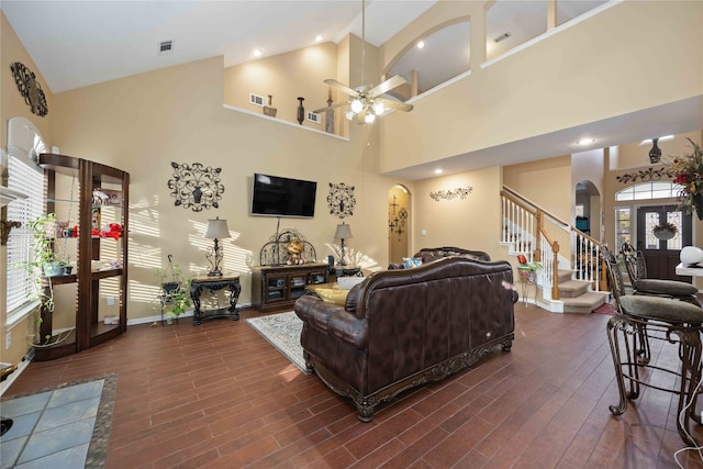 living room featuring high vaulted ceiling, dark wood-type flooring, and ceiling fan