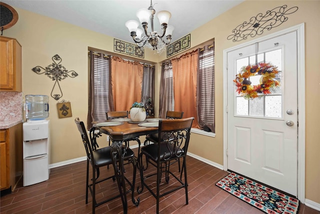 dining area featuring a chandelier and dark hardwood / wood-style floors