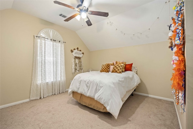 bedroom featuring lofted ceiling, light carpet, and ceiling fan