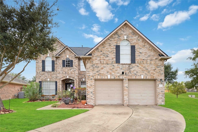 front of property featuring a garage, central AC unit, and a front lawn