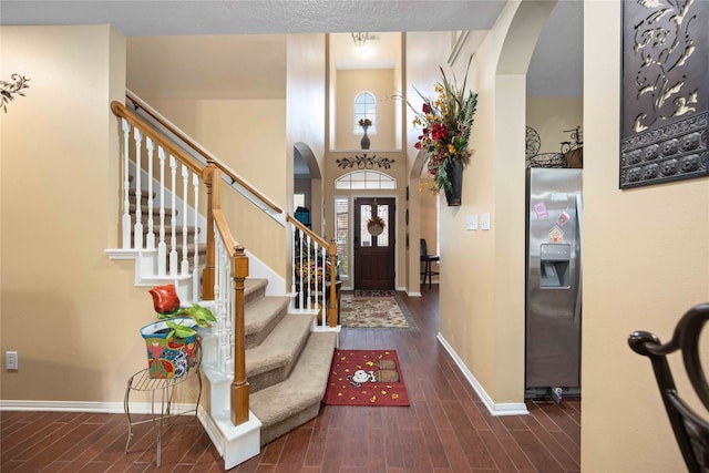 foyer entrance featuring dark wood-type flooring